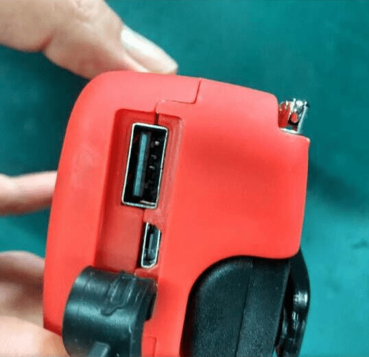 Shows customer handling red radio flashlight.