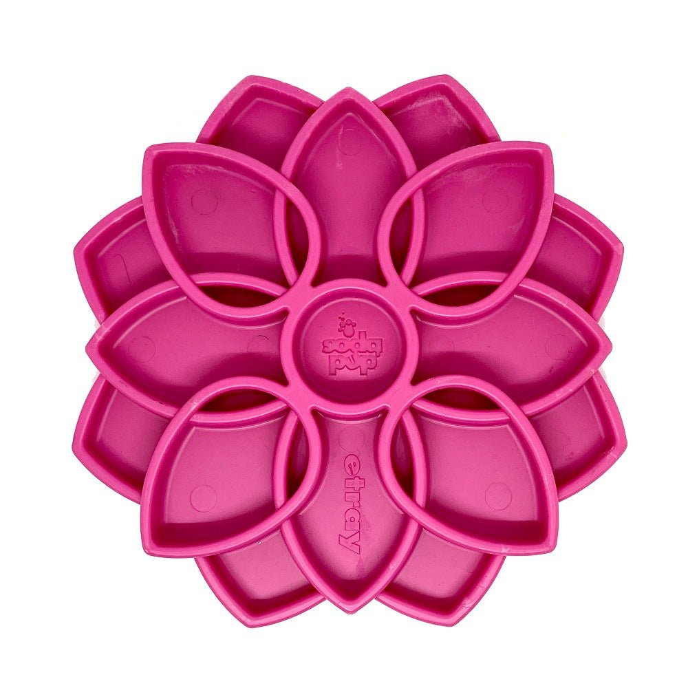 Pink flower-shaped silicone ice cube tray with petal compartments for slow feeding and mental stimulation.