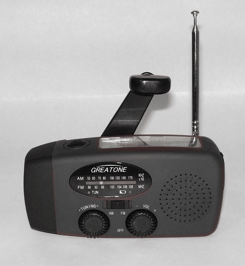 Displays red radio flashlight with antenna raised.