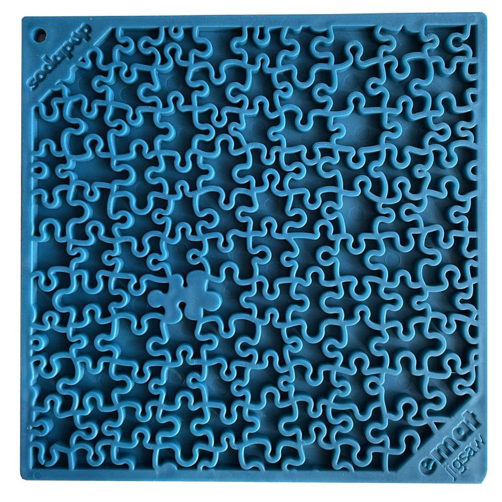 Blue silicone jigsaw puzzle mat with interlocking piece design for slow feeding and mental stimulation.
