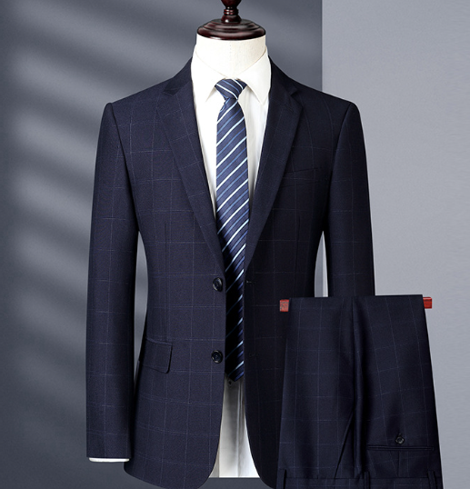Navy checkered suit jacket with striped tie on a mannequin against a gray background