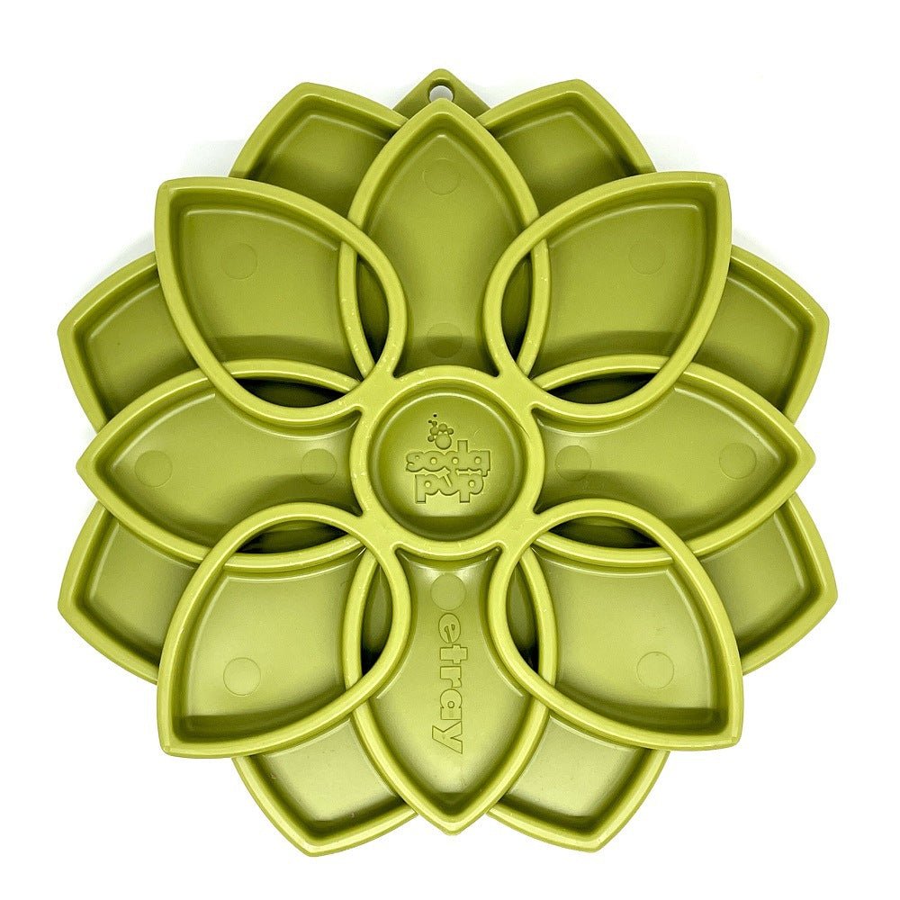 Green flower-shaped silicone tray for slow feeding and mental stimulation.