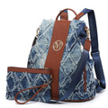 Denim-patterned backpack with brown accents on a white background