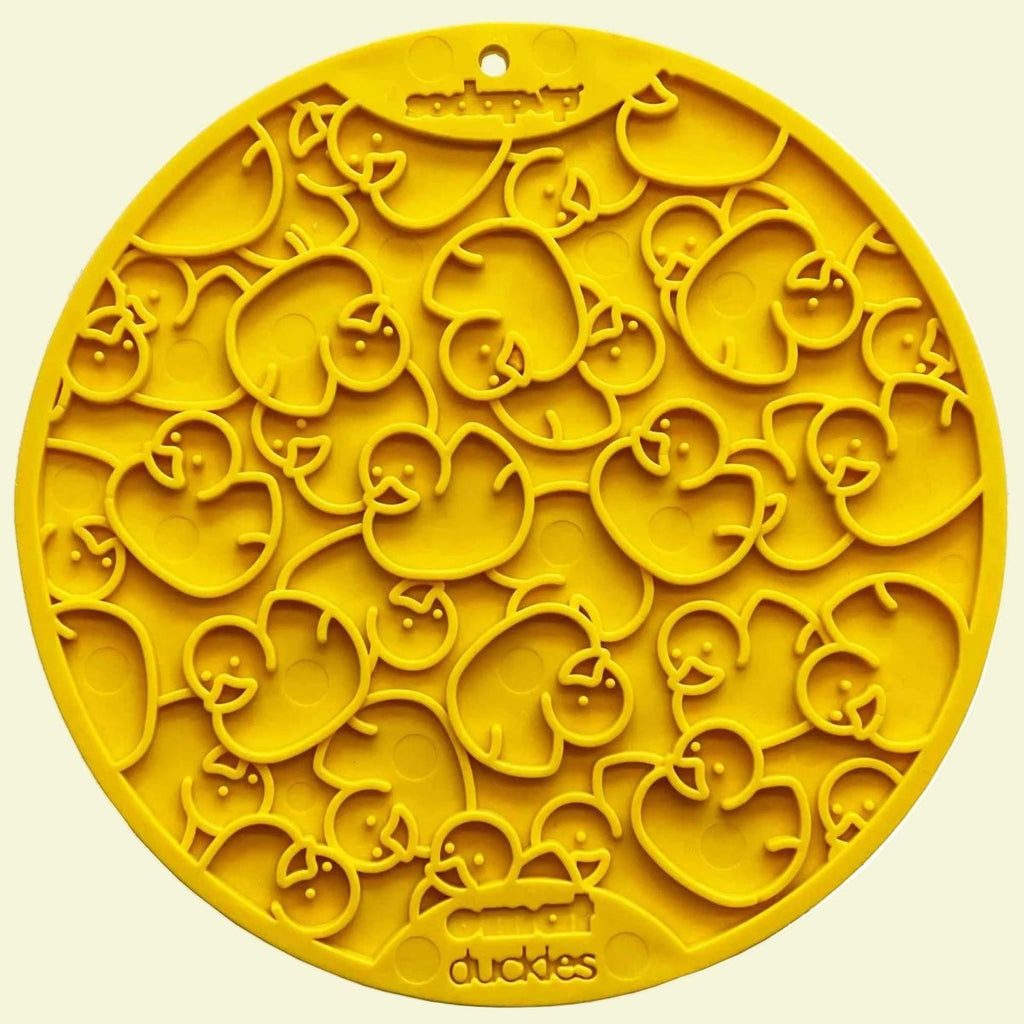 Yellow silicone placemat with cute duck designs, perfect for slow feeding and mental stimulation.